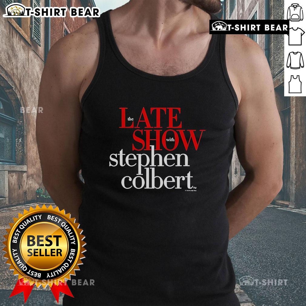 Stephen Colbert wearing a humorous tank top on The Late Show, showcasing his signature comedic style and personality.