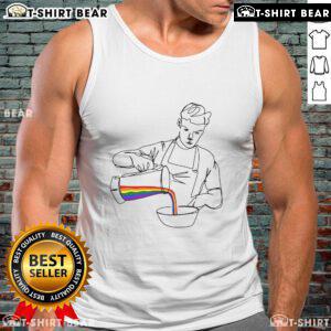 Will Poulter wearing a vibrant LGBT tank top, showcasing pride and colorful design at a public event.