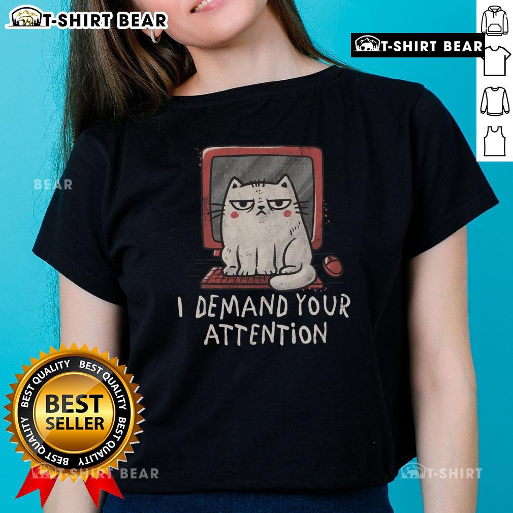 Alt Text: Cute cat sitting on a keyboard with a playful expression, perfect for the I Demand Your Attention ladies' tee design.