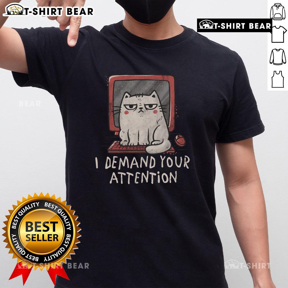 Cute cat on keyboard graphic on 'I Demand Your Attention' t-shirt, perfect for cat lovers and humorous apparel.