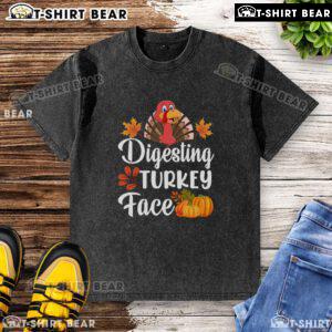 Funny digesting turkey face graphic on a Thanksgiving washed t-shirt, perfect for holiday humor and festive gatherings.