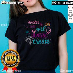 Girl in a funny Easter tee hunting for diamonds instead of eggs, showcasing the 'Forget the Eggs' ladies shirt design.