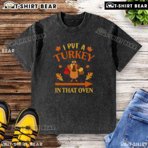Funny Thanksgiving t-shirt featuring 'I Put A Turkey In That Oven' design, perfect for holiday celebrations.