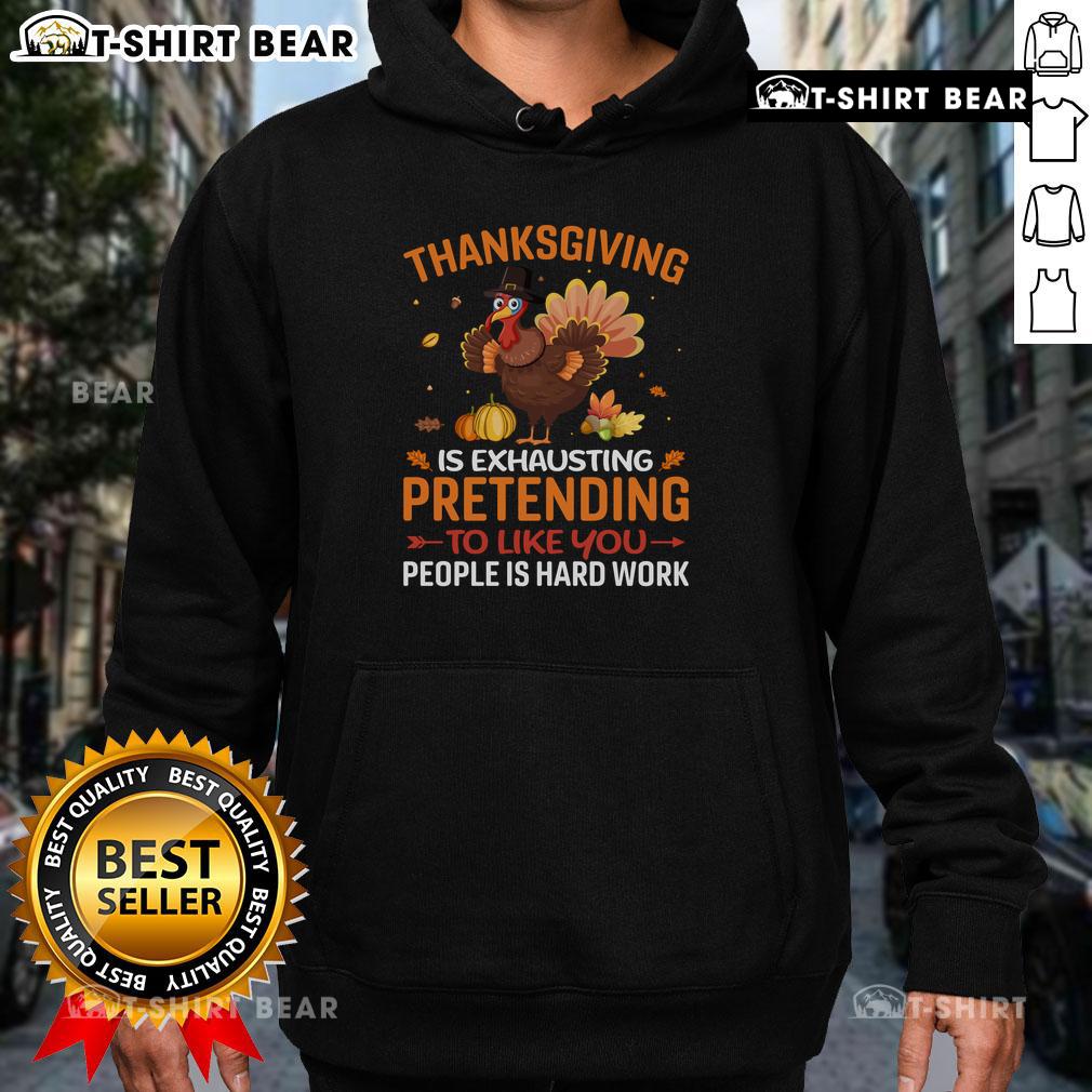 Alt Text: Funny Thanksgiving hoodie featuring the phrase Pretending to like you people is hard work for humor lovers.