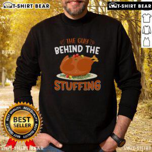 Funny Thanksgiving sweatshirt featuring the phrase 'The Guy Behind The Stuffing' for festive holiday humor.