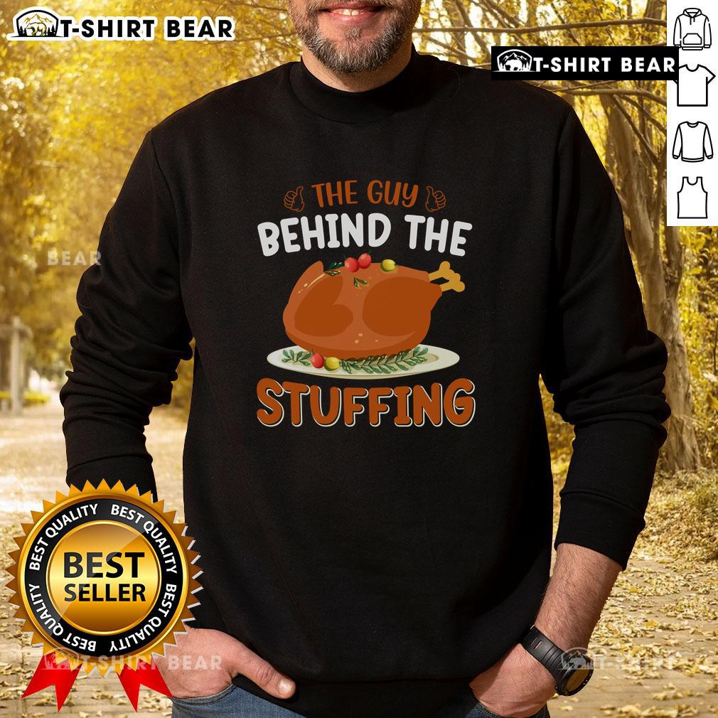 Funny Thanksgiving sweatshirt featuring the phrase 'The Guy Behind The Stuffing' for festive holiday humor.