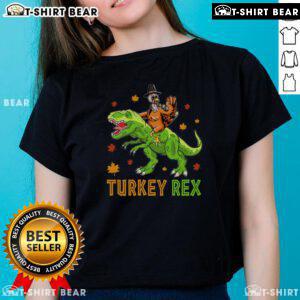 Funny Turkey Rex Thanksgiving ladies tee featuring a whimsical dinosaur design, perfect for festive holiday celebrations.