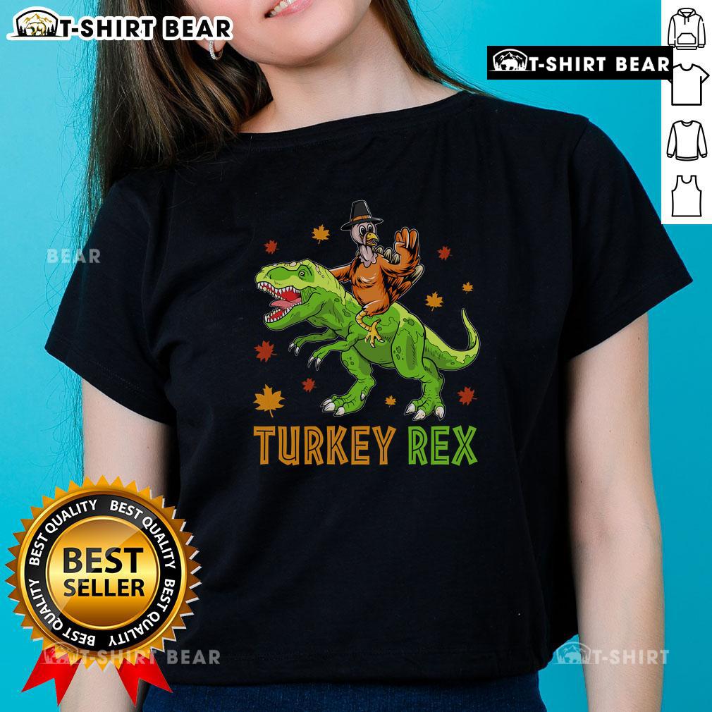 Funny Turkey Rex Thanksgiving ladies tee featuring a whimsical dinosaur design, perfect for festive holiday celebrations.