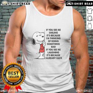Good Snoopy tank top featuring the phrase 'If you see me smiling, it's because I'm thinking of doing something bad.'