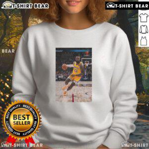 LeBron James in a stylish Los Angeles Lakers sweatshirt, showcasing his superstar status in number 23 jersey pose.