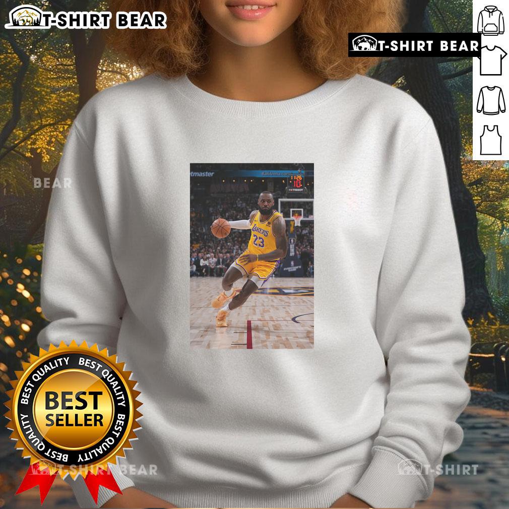 LeBron James in a stylish Los Angeles Lakers sweatshirt, showcasing his superstar status in number 23 jersey pose.