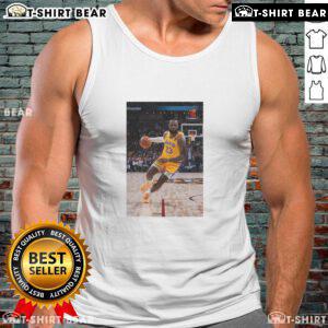 LeBron James in a tank top, showcasing his Los Angeles Lakers No. 23 jersey, striking a superstar pose on the court.