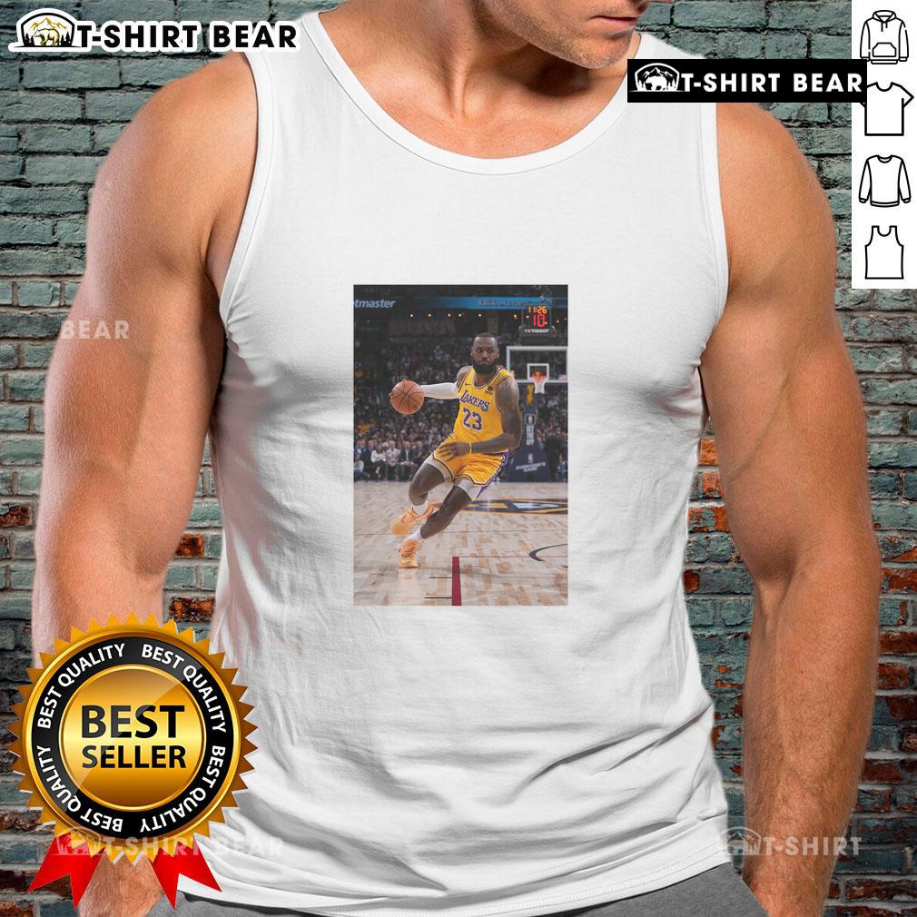 LeBron James in a tank top, showcasing his Los Angeles Lakers No. 23 jersey, striking a superstar pose on the court.