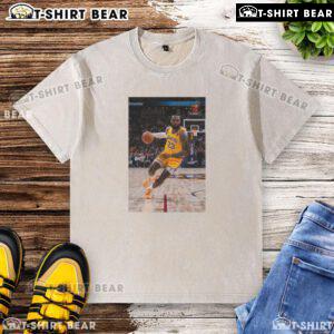 LeBron James in a Los Angeles Lakers No. 23 washed t-shirt, showcasing his superstar pose on the basketball court.