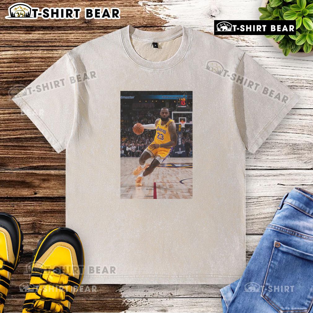LeBron James in a Los Angeles Lakers No. 23 washed t-shirt, showcasing his superstar pose on the basketball court.