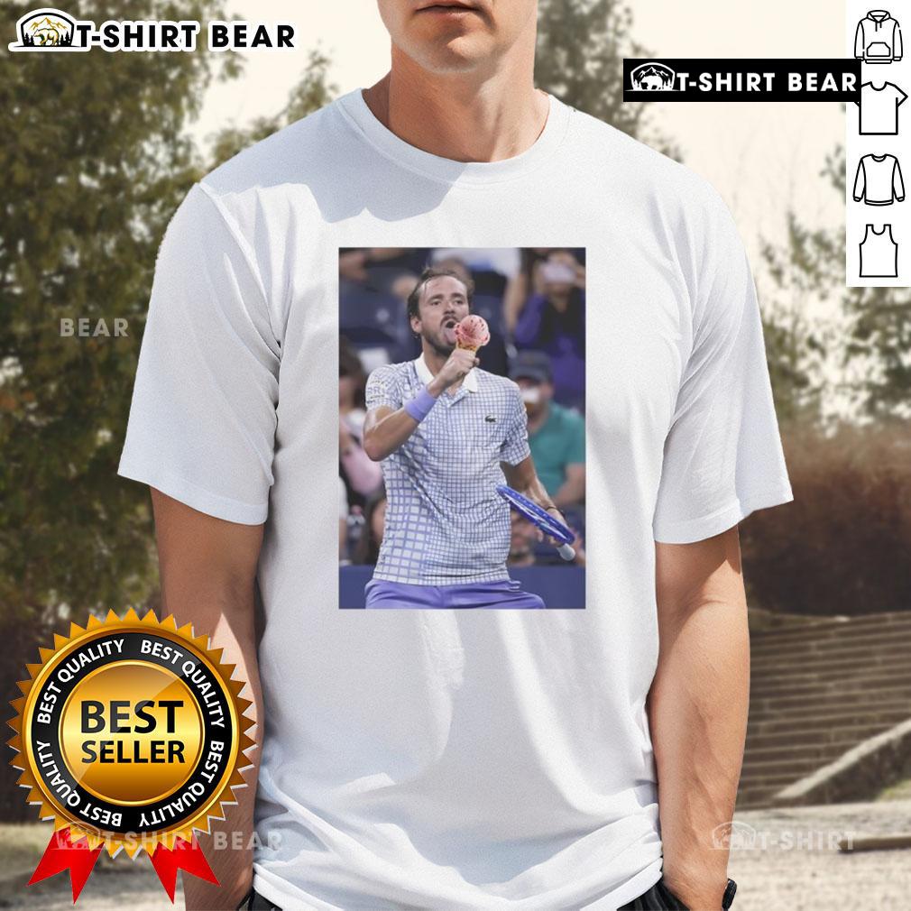 Hot Medvedev enjoying ice cream on the field, wearing a US Open T-shirt, captures a fun moment at the tournament.