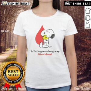 Nice A Little Goes A Long Way Give Blood Snoopy Ladies Tee featuring a vibrant Snoopy design promoting blood donation.