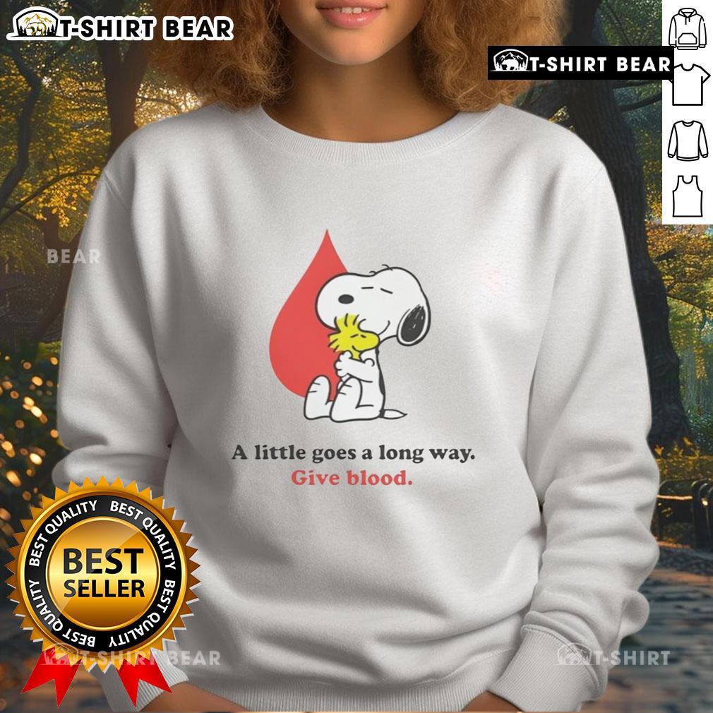 Nice A Little Goes A Long Way Give Blood Snoopy Sweatshirt featuring Snoopy promoting blood donation in a cozy design.