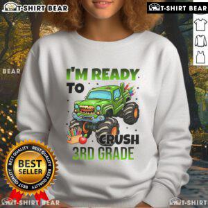 Child wearing a 'I'm Ready to Crush 3rd Grade' monster truck sweatshirt, showcasing vibrant colors and playful design.