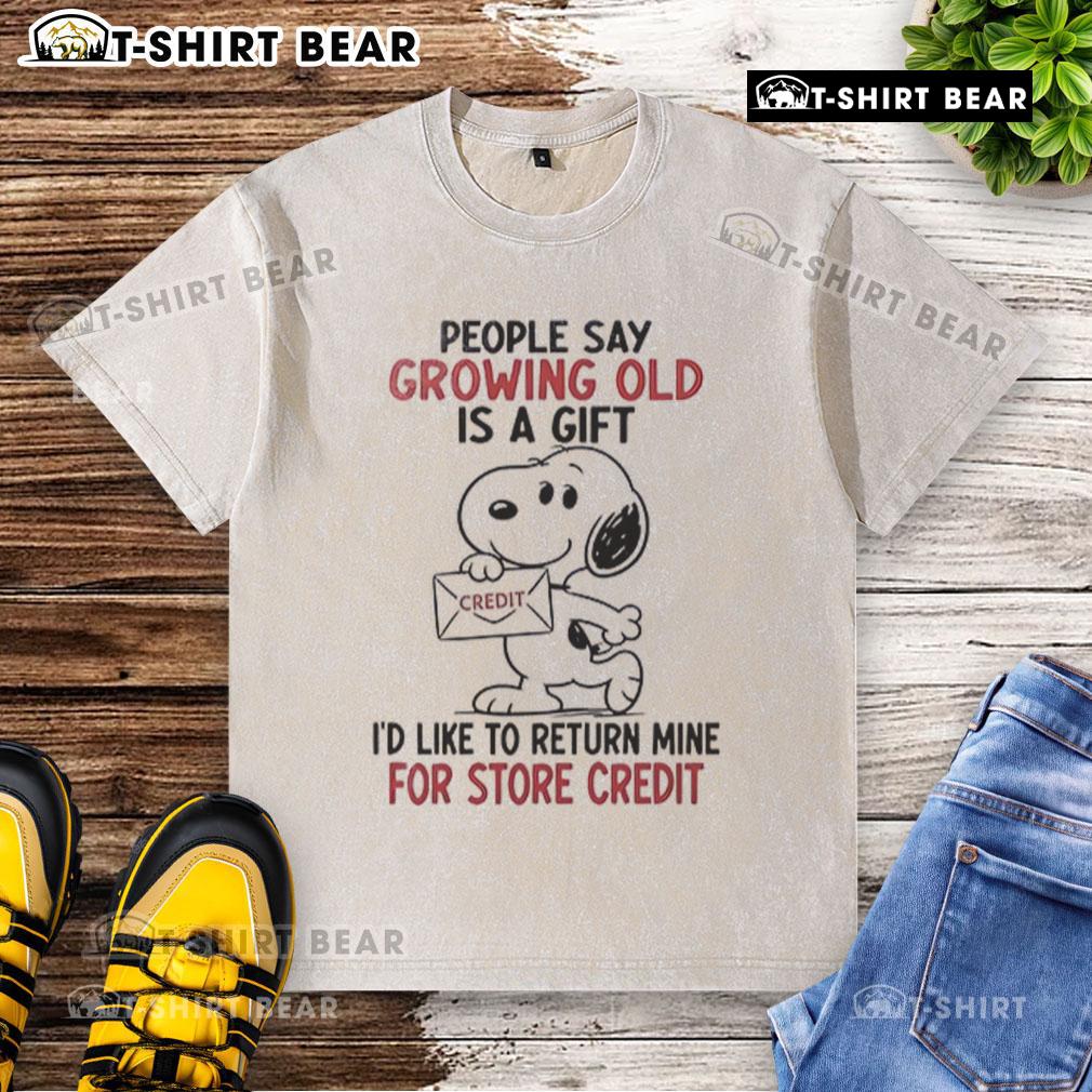 Original Snoopy Growing Old Is A Gift washed t-shirt featuring Snoopy and a humorous quote about aging.