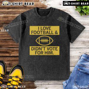 Premium I Love Football and Didn't Vote For Him washed t-shirt, perfect for football fans expressing their views.