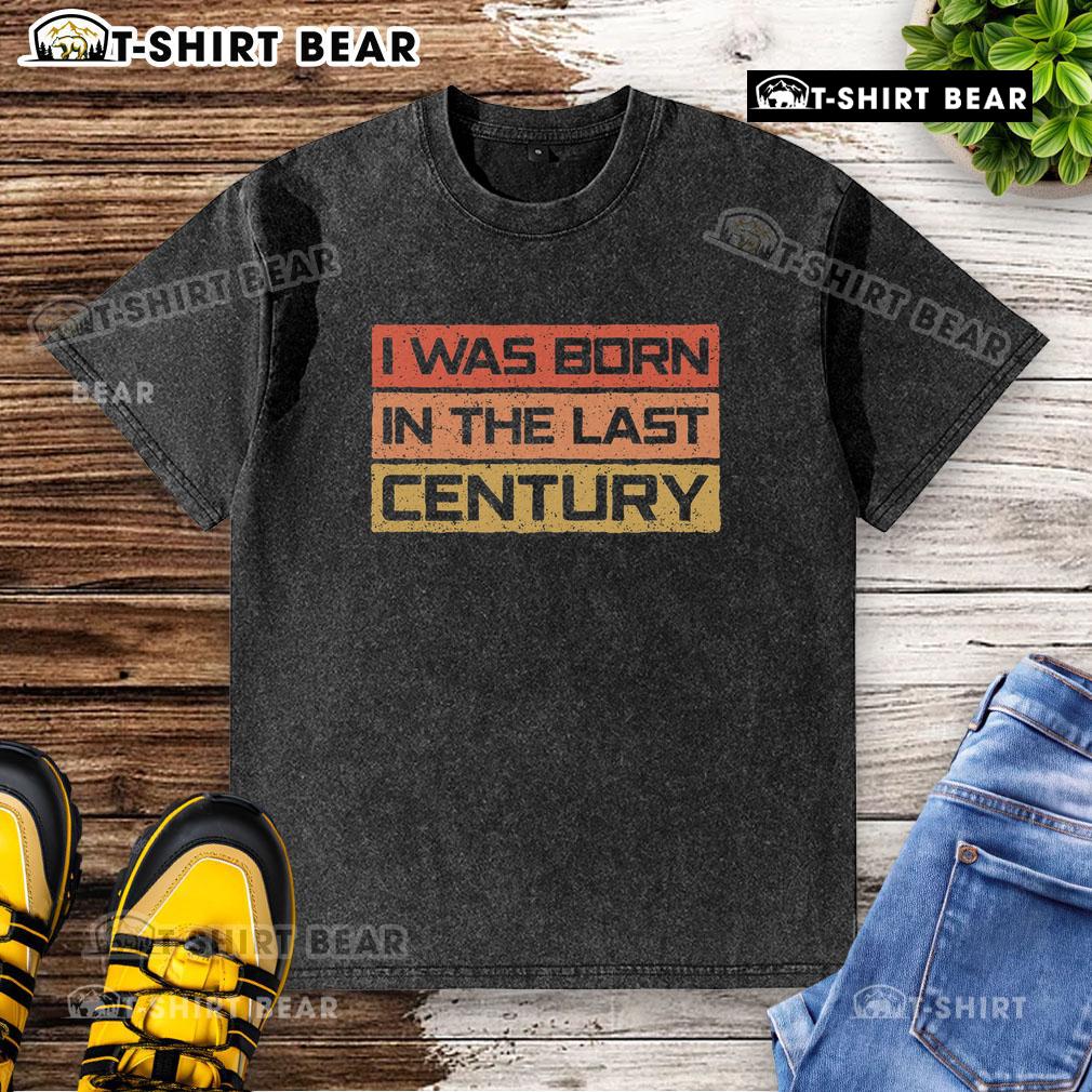 Vintage washed t-shirt featuring 'I Was Born in the Last Century' design, perfect for retro fashion enthusiasts.