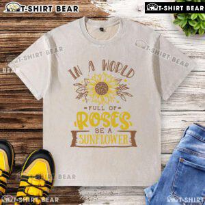 Premium 'Be a Sunflower' washed t-shirt design amidst vibrant roses, perfect for casual summer style.