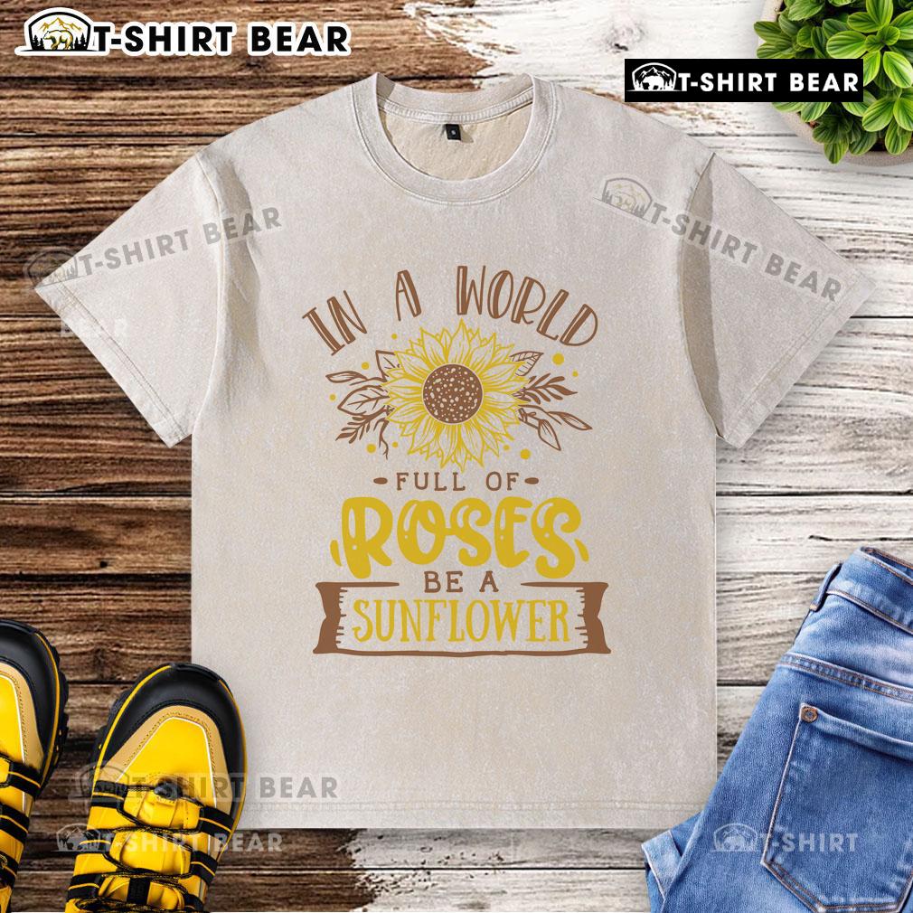 Premium 'Be a Sunflower' washed t-shirt design amidst vibrant roses, perfect for casual summer style.