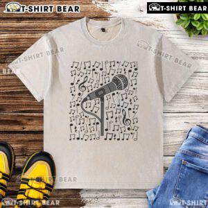 Alt Text: Premium singer microphone and musical notes design on a washed t-shirt for singing teachers and musicians.