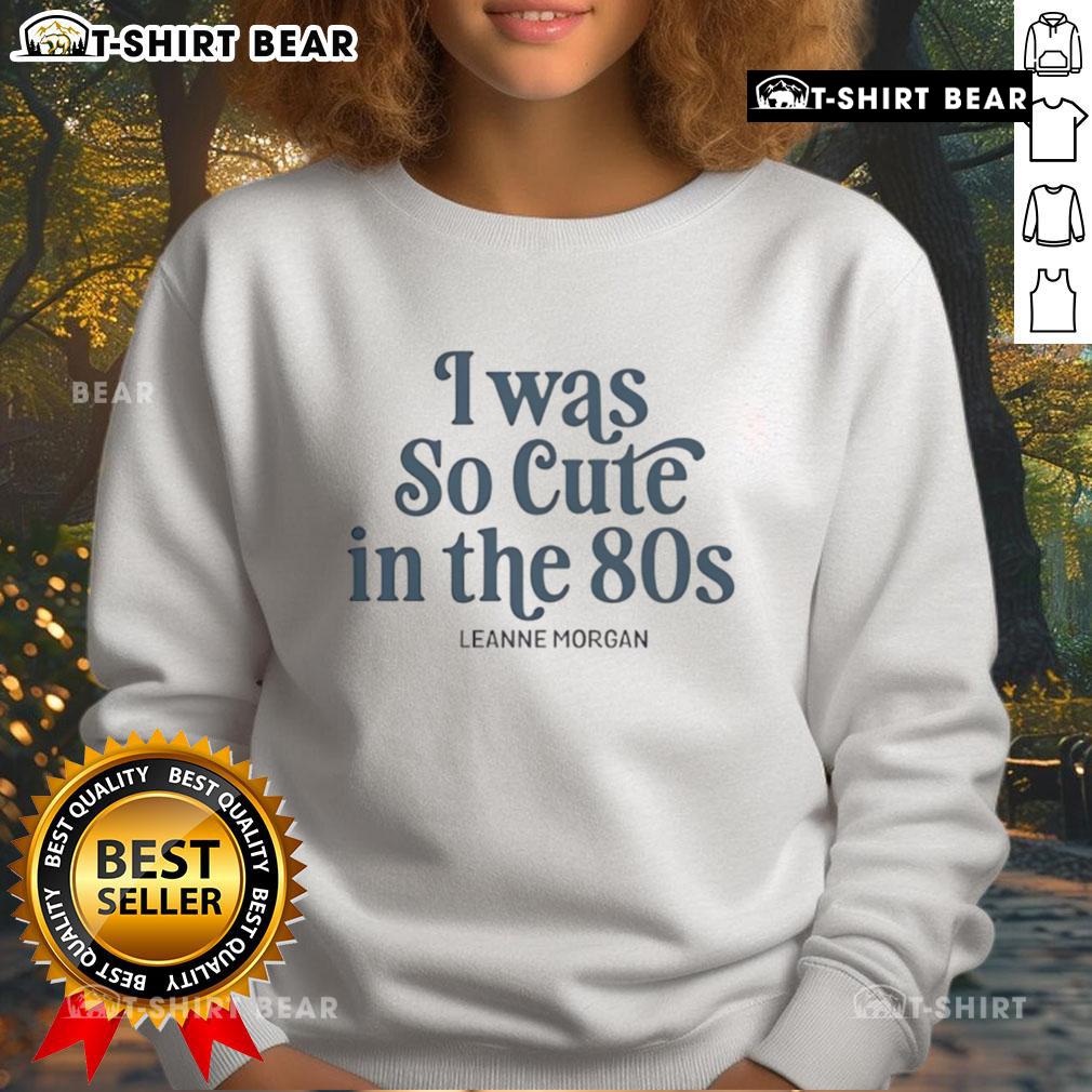 Leanne Morgan wearing a vibrant 'Pretty I Was So Cute in the 80s' sweatshirt, showcasing retro fashion and fun style.