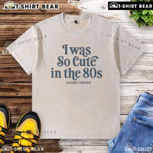 Leanne Morgan wearing a vintage washed T-shirt, showcasing her cute 80s style in a charming outdoor setting.