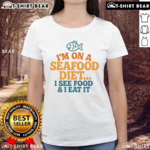 Funny ladies tee featuring 'I'm on a seafood diet: I see food, I eat it' slogan, perfect for seafood lovers.