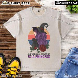 Pretty in a World Full of Witches Be a Princess Halloween washed t-shirt, perfect for festive fall celebrations.
