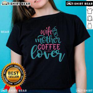 Pretty wife and mother enjoying coffee while wearing a stylish 'Coffee Lover' ladies tee, radiating warmth and happiness.