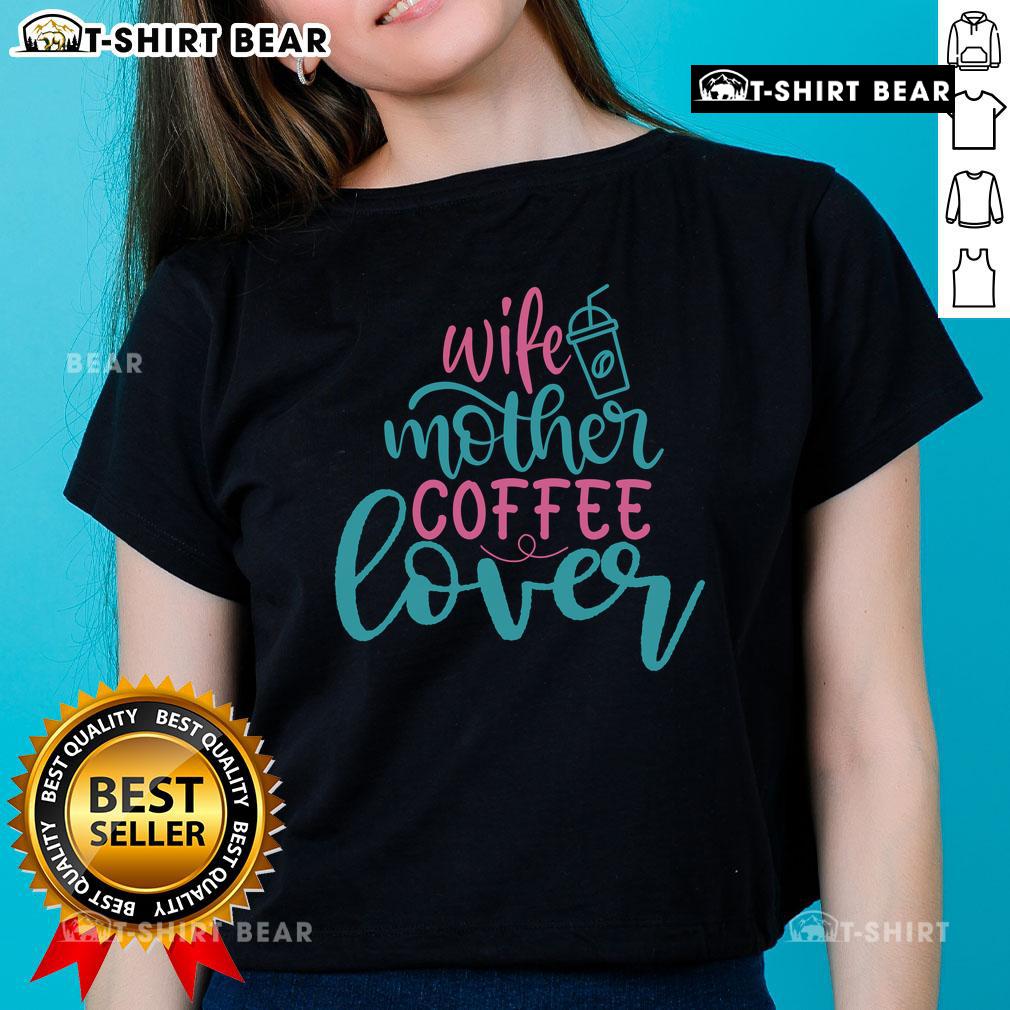 Pretty wife and mother enjoying coffee while wearing a stylish 'Coffee Lover' ladies tee, radiating warmth and happiness.