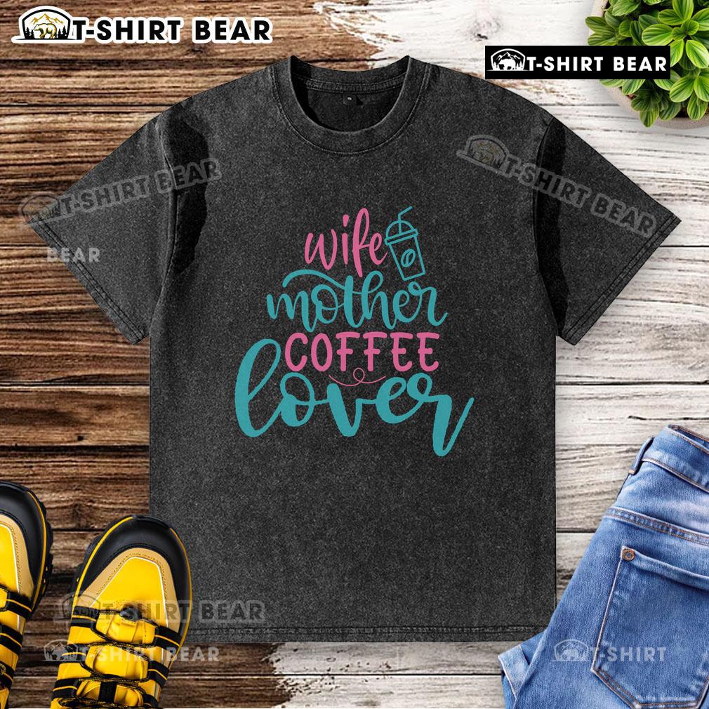 Pretty wife and mother in a coffee lover washed t-shirt, enjoying a cup of coffee at home.