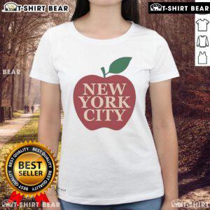 Eric Stonestreet wearing a New York City Apple Ladies Tee, showcasing a stylish urban look in vibrant city scenery.