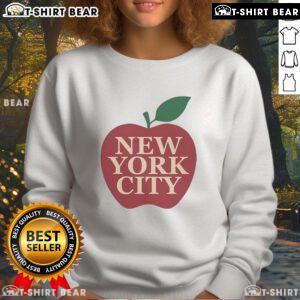 Eric Stonestreet wearing a trendy New York City apple sweatshirt, showcasing a stylish urban look.