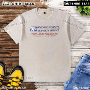 Top Fcking Rabbits Sexpress Service washed t-shirt displayed on a wooden background, showcasing a playful graphic design.