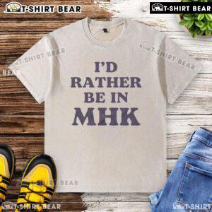 Top 'I'd Rather Be In MHK' washed t-shirt displayed on a hanger, perfect for casual wear and expressing love for Manhattan, KS.