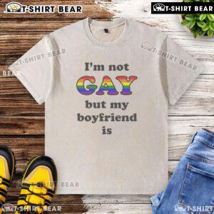 Top I'm Not Gay But My Boyfriend Is T-Shirt, featuring a humorous slogan in bold letters on a casual tee.
