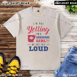 Top 'Im Not Yelling, Im an Arkansas Girl, We Just Talk Loud' washed t-shirt, perfect for showcasing Southern pride.
