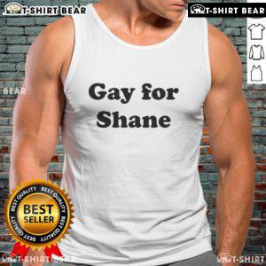 Alt Text: Jennifer Beals wearing a stylish tank top, showcasing her fashion sense in a casual, gay pride-themed look.