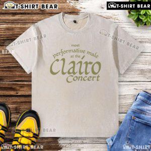 Top most performative male at the Clairo concert wearing a washed t-shirt, engaging the crowd with energy.