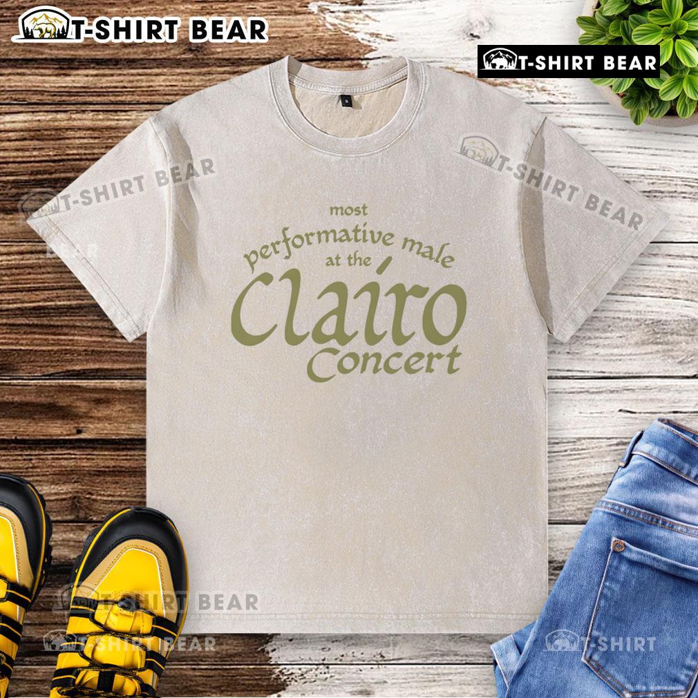 Top most performative male at the Clairo concert wearing a washed t-shirt, engaging the crowd with energy.