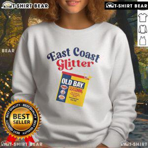 Alt Text: Cozy sweatshirt featuring Top Old Bay East Coast Glitter Seasoning design, perfect for seafood lovers and stylish comfort.