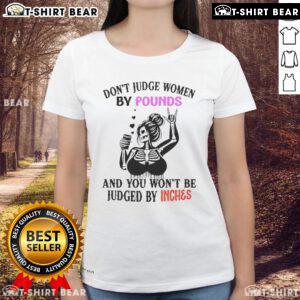 Women's tee featuring a top skeleton design with the slogan 'Don't Judge Women By Pounds And You Won't Be Judged By Inches'.