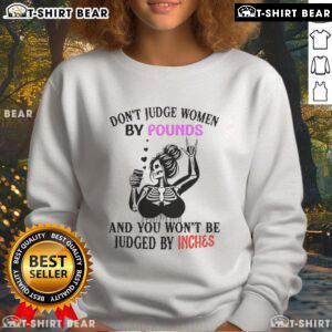 Top Skeleton sweatshirt with 'Don't Judge Women By Pounds And You Won't Be Judged By Inches' slogan in bold design.