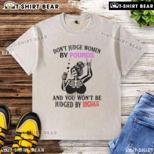 Alt Text: Top Skeleton design on a washed t-shirt with the quote 'Don't judge women by pounds and you won't be judged by inches.'