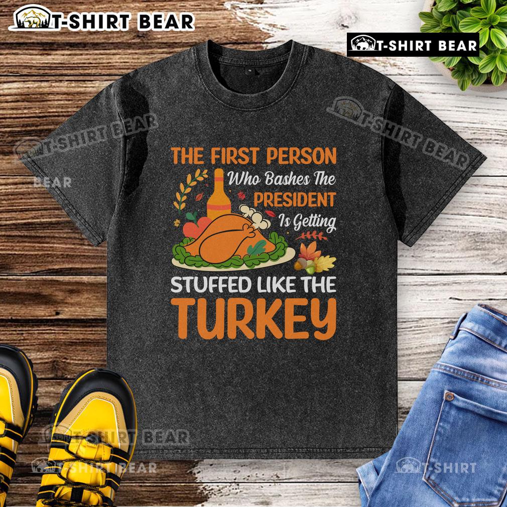 Graphic t-shirt featuring a humorous design about bashing the president, featuring a turkey and playful text.